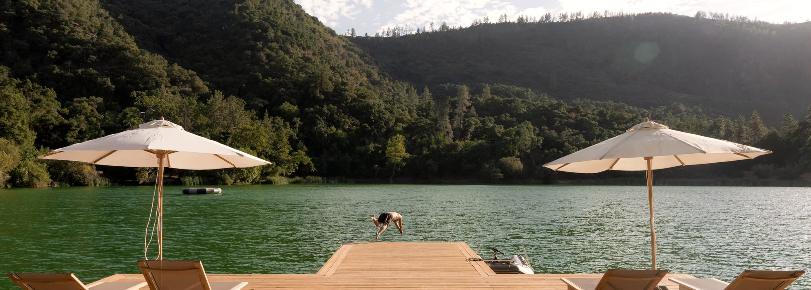 The swimming dock with white umbrellas